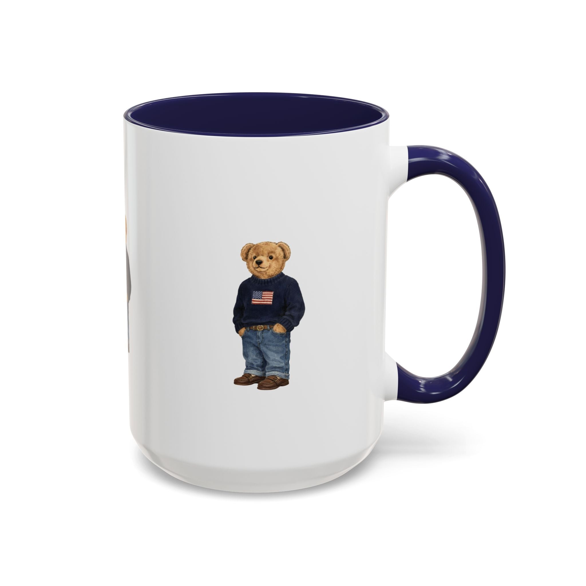 White ceramic mug with navy rim and handle; teddy bear graphic in navy sweater