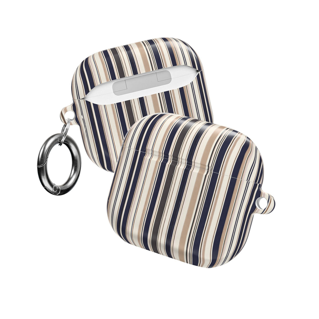 Striped AirPods case with textured shell, navy and tan vertical stripes, top handle and rings