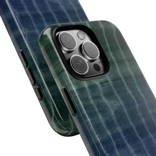 Ocean shibori tie-dye phone case corner view with teal-blue striped swirl pattern