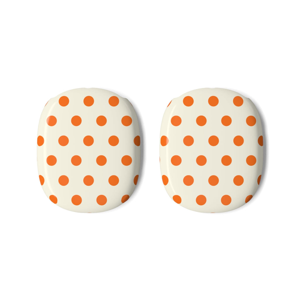 Two cream ear cup covers with orange polka dots for AirPods Max.
