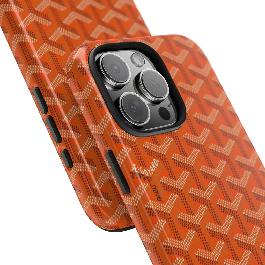 Orange phone case with Goyard-style pattern, side button openings and camera lenses