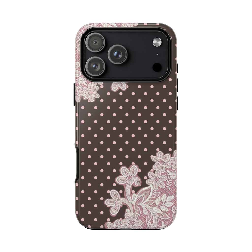 Brown phone case with pink polka dots, white lace detailing, raised camera cutout