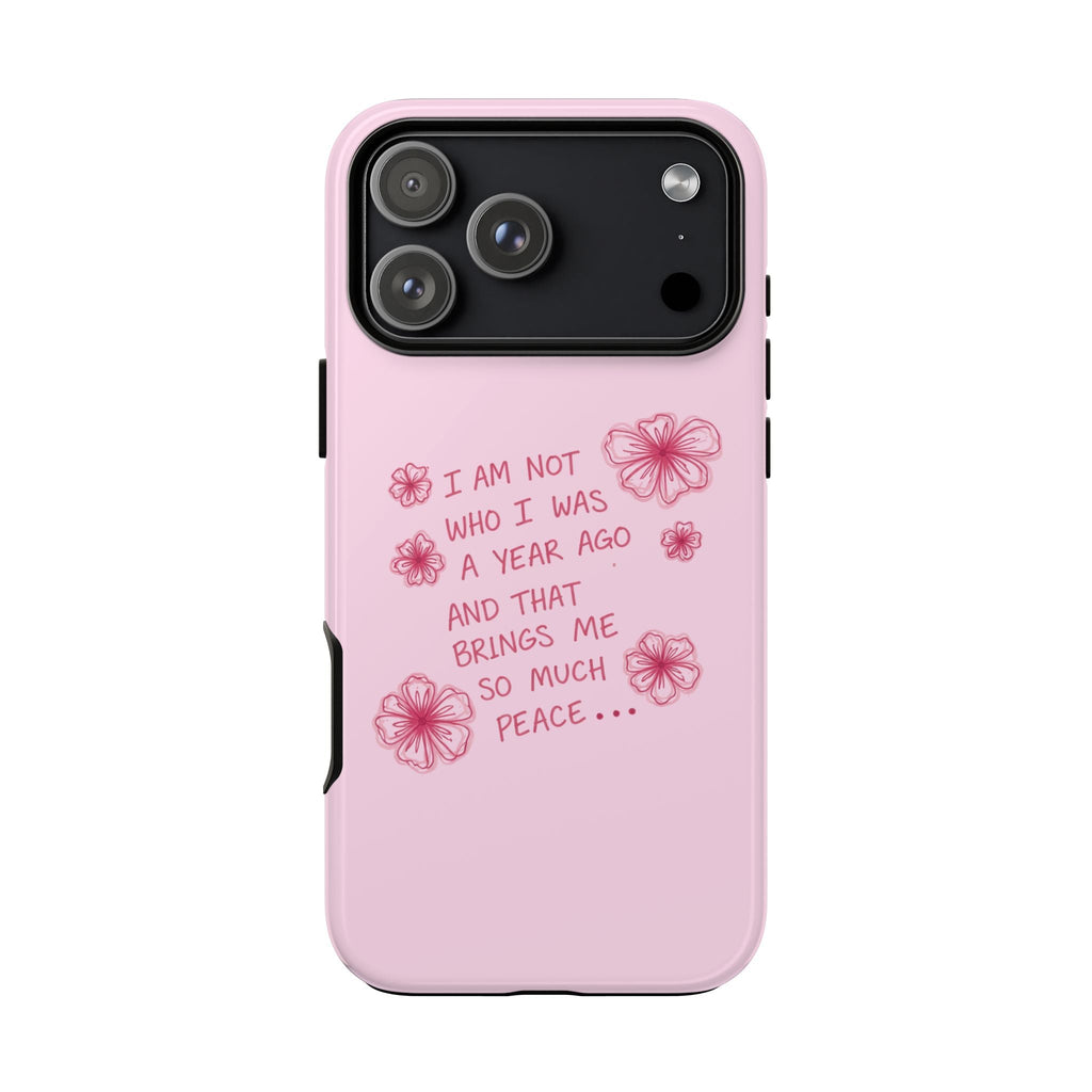Pink phone case with floral quote on back, camera module cutout