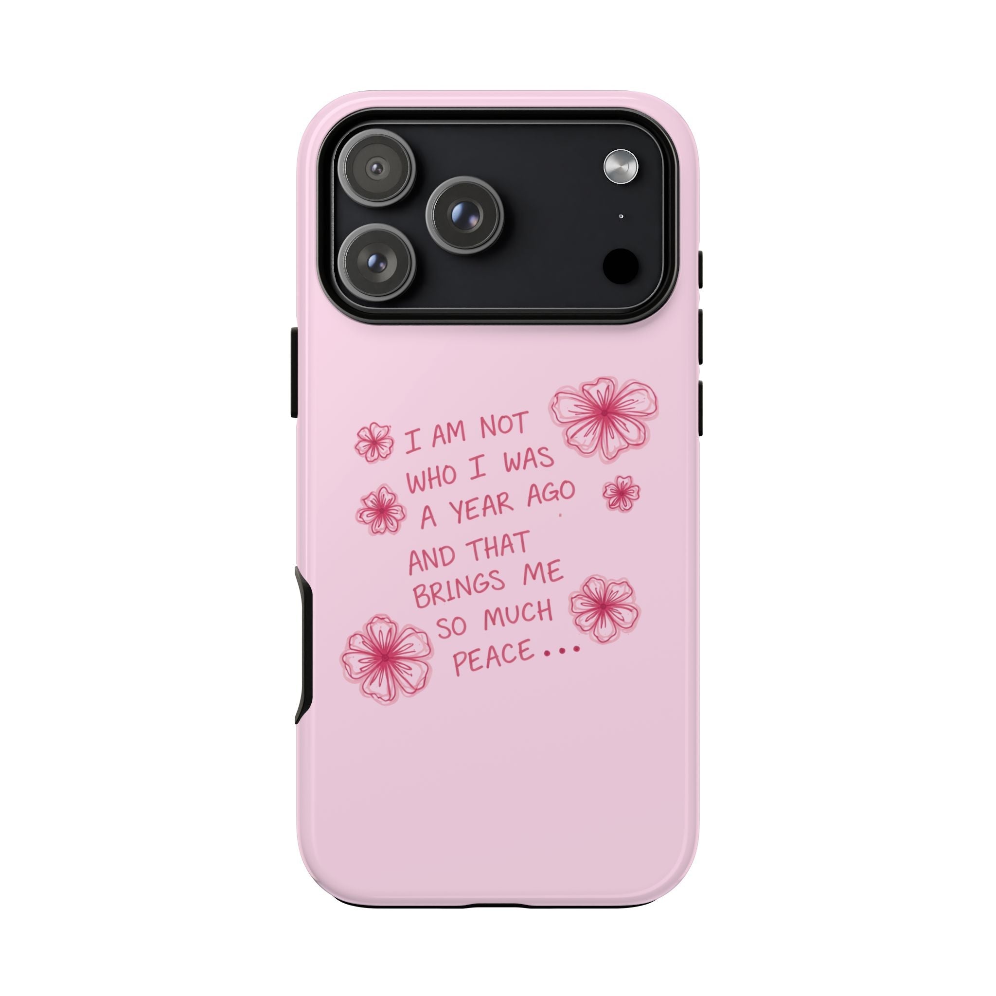 Pink phone case with floral quote on back, camera module cutout