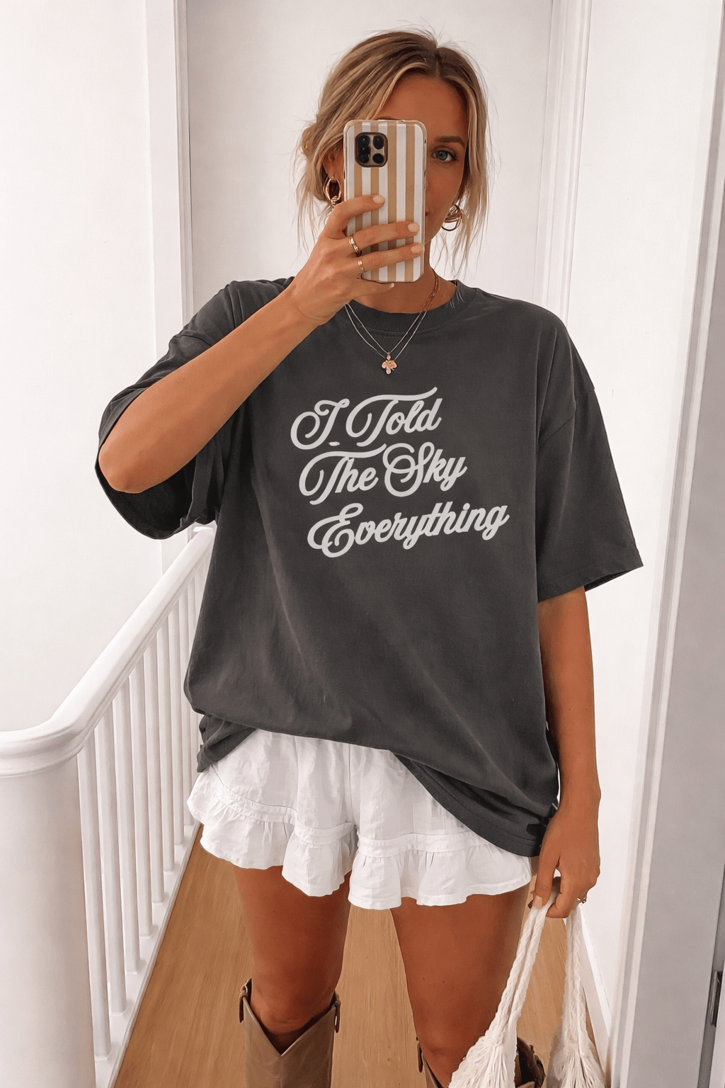 Dark gray T-shirt with white "I Told The Sky Everything" script logo