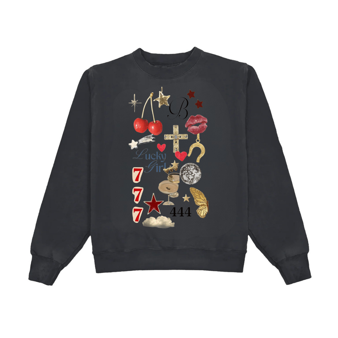 Dark crewneck sweatshirt with Lucky Girl graphic, stars, hearts, numbers 777 and 444.