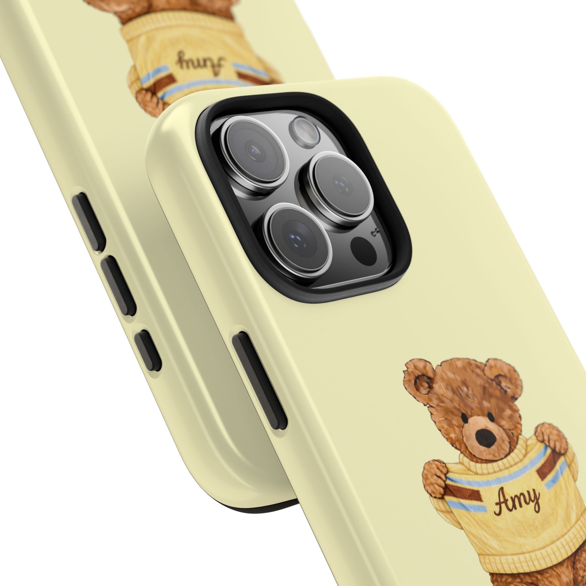 Side view: butter yellow phone case with teddy bear sweater graphic, name Amy