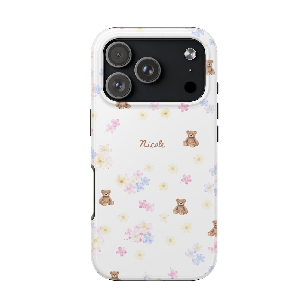 White phone case with pastel flowers and teddy bears; 'Nicole' name text and camera cutout