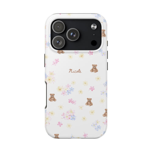 White phone case with pastel flowers and teddy bears; 'Nicole' name text and camera cutout