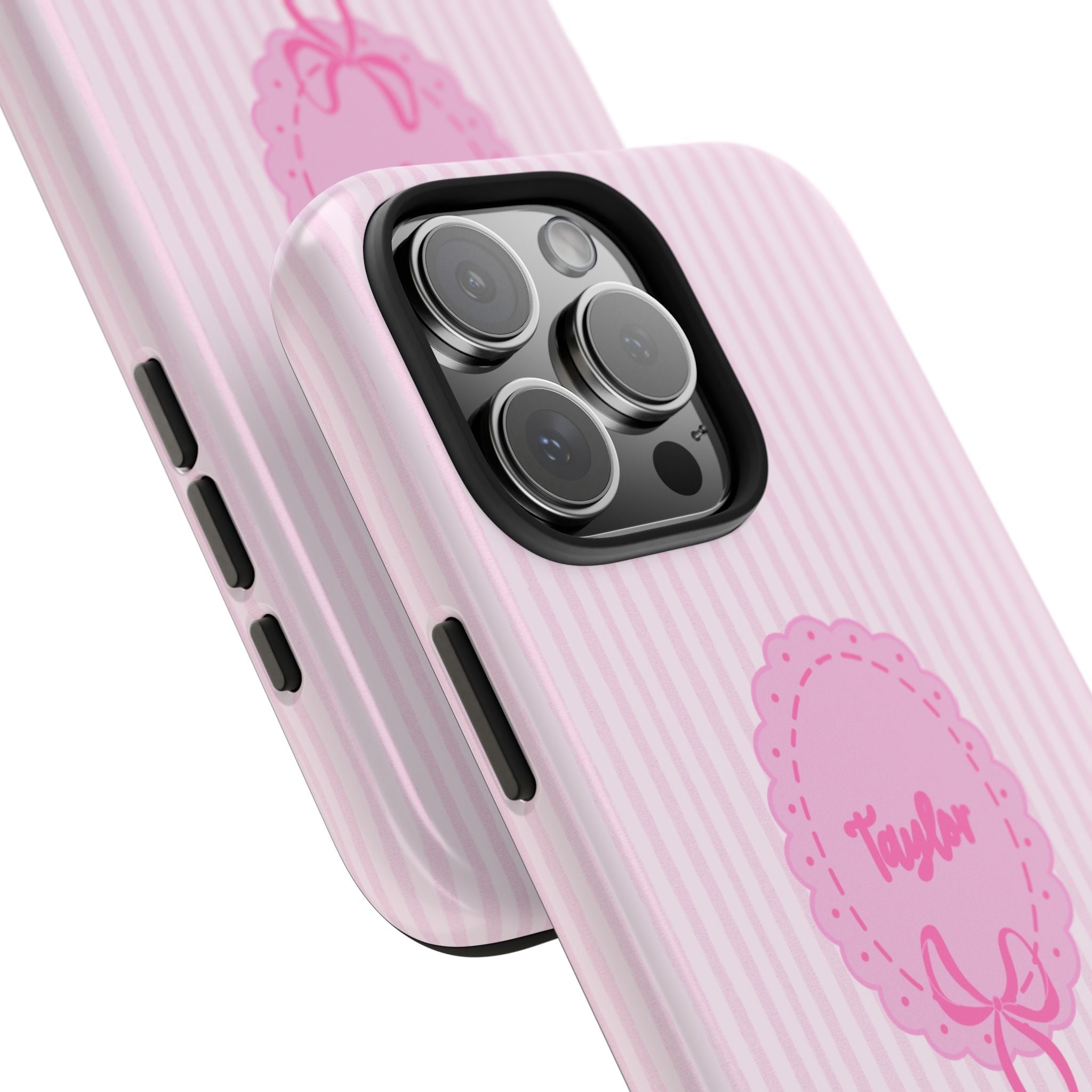 Pink striped case detail: Taylor name badge, bow motif, side buttons and camera