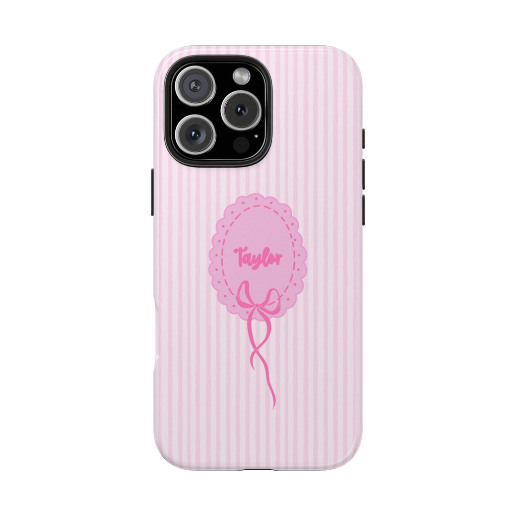 Pink striped phone case with Taylor name medallion and bow, visible camera cutout