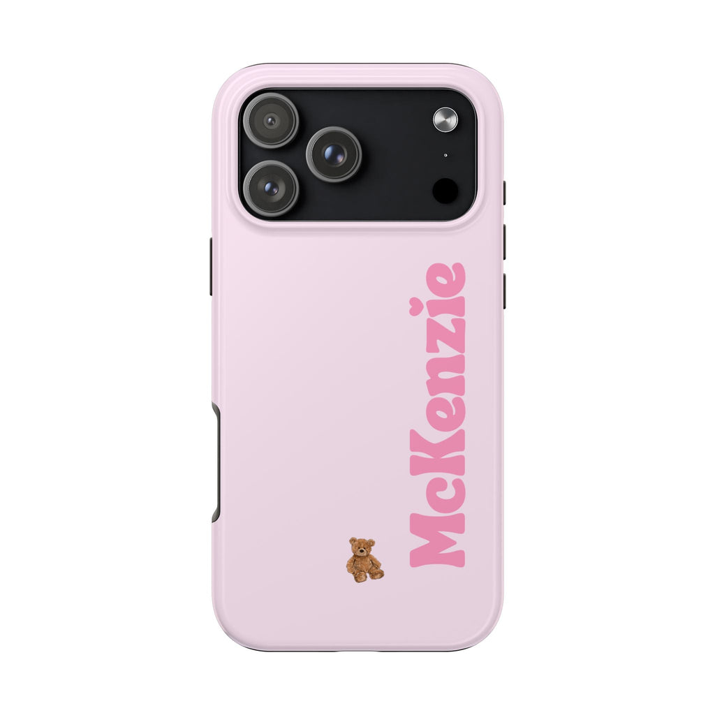 Pink baby phone case with custom name and teddy bear charm; camera area visible.