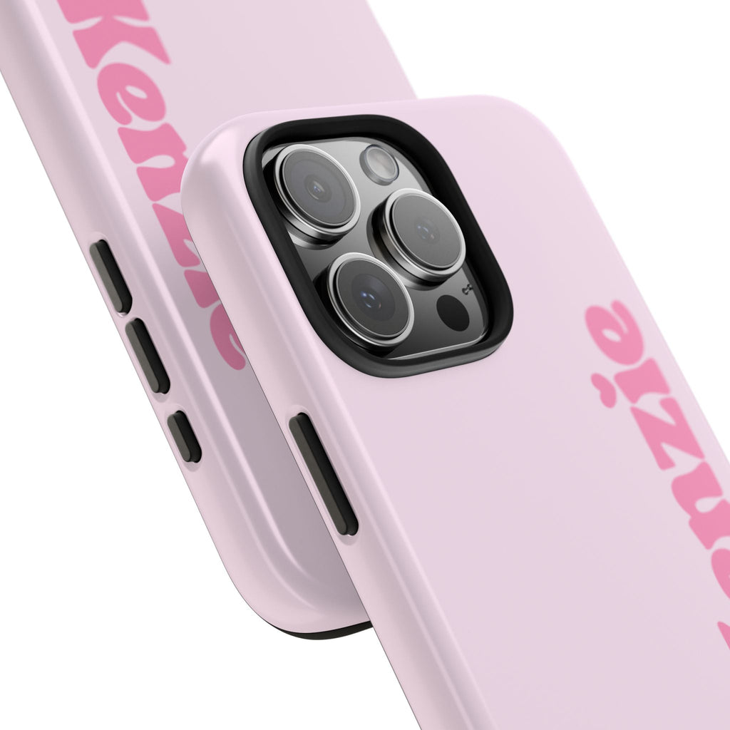 Pink custom baby phone case with name and teddy bear; side buttons and camera bump shown.