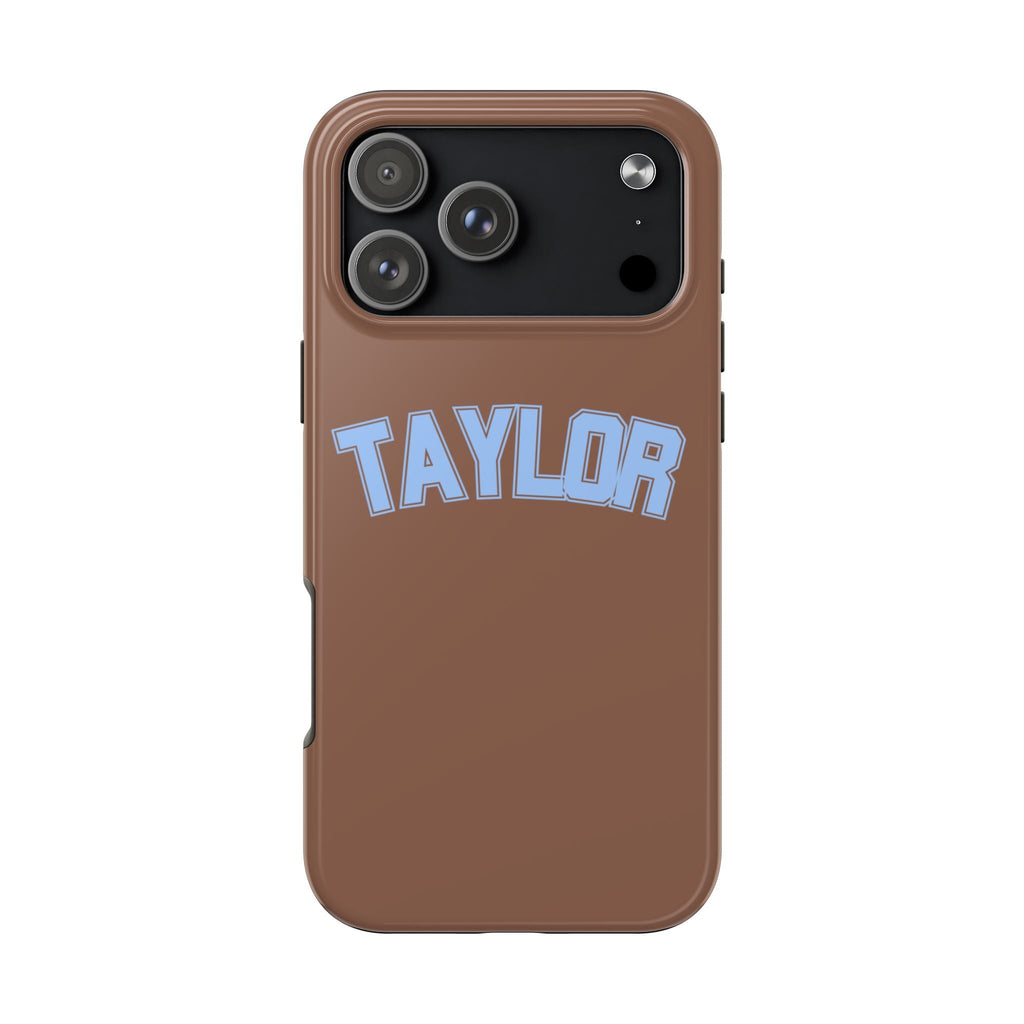 Brown custom varsity phone case with blue name TAYLOR, black camera panel