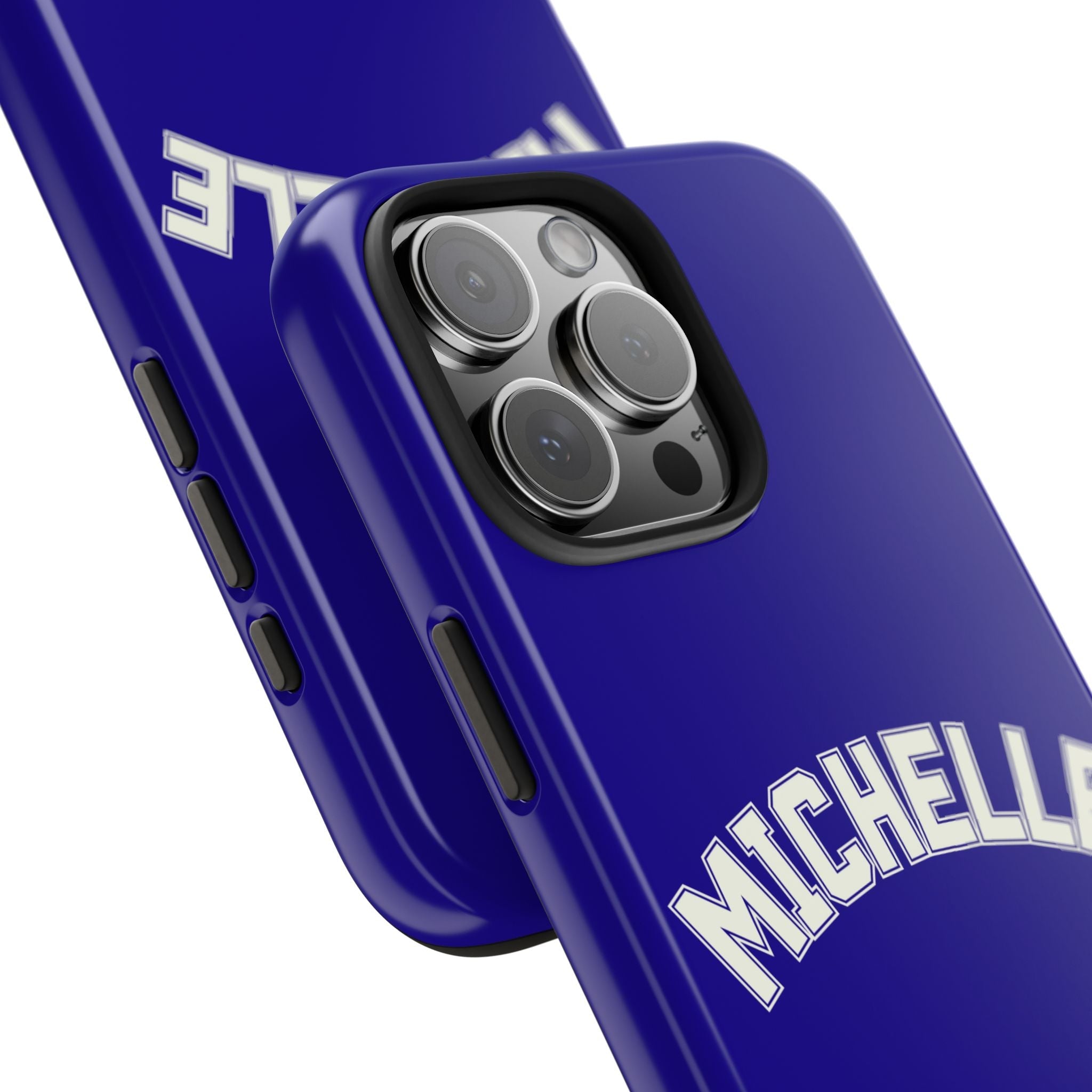 Angled navy varsity phone case showing “MICHELLE” and raised camera cutout