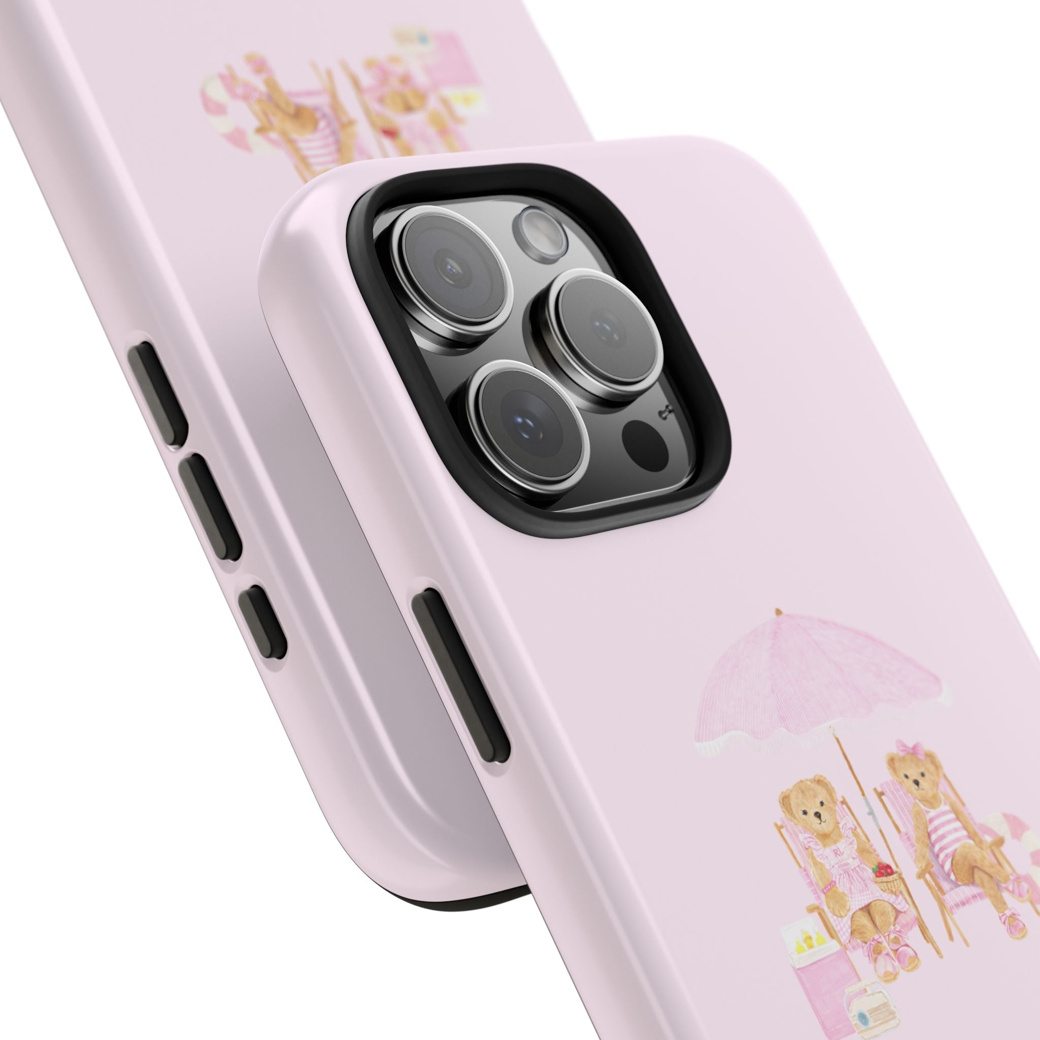 Close-up pink phone case with teddy bear beach design and camera cutout