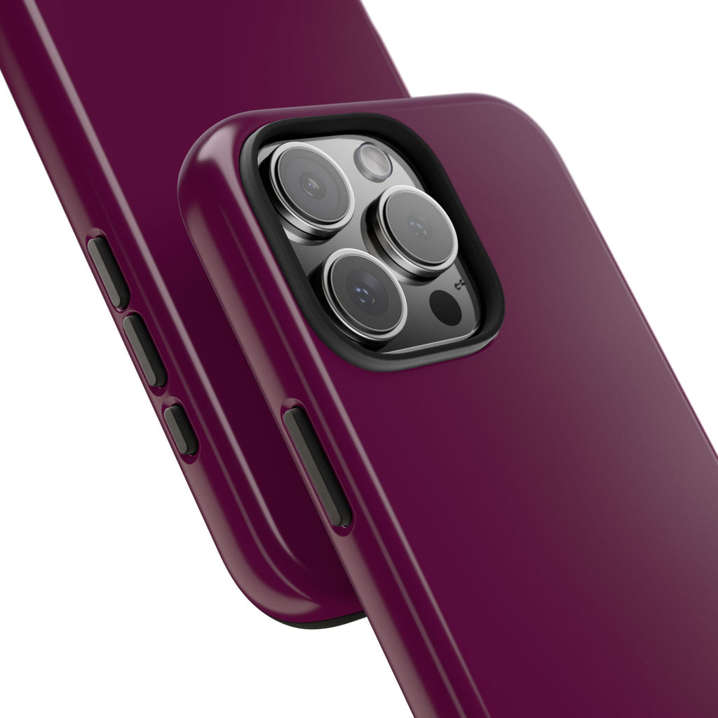 Plum phone case corner detail showing camera cutout and side buttons