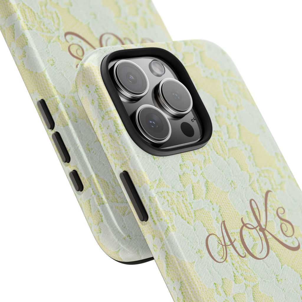 Yellow lace phone case angled view with monogram initials and camera lens openings