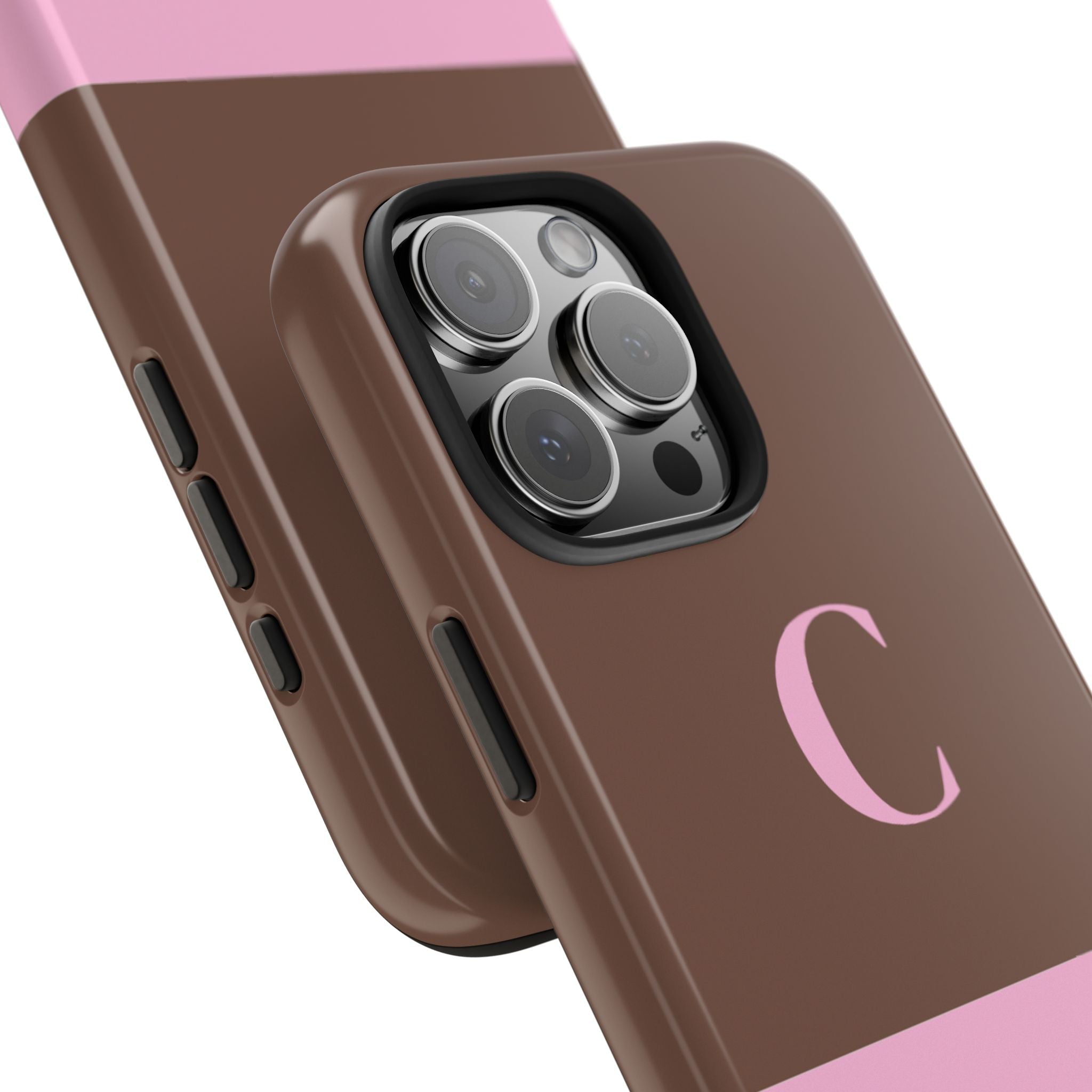 Angled two-tone brown and pink phone case with camera cutout and initial C
