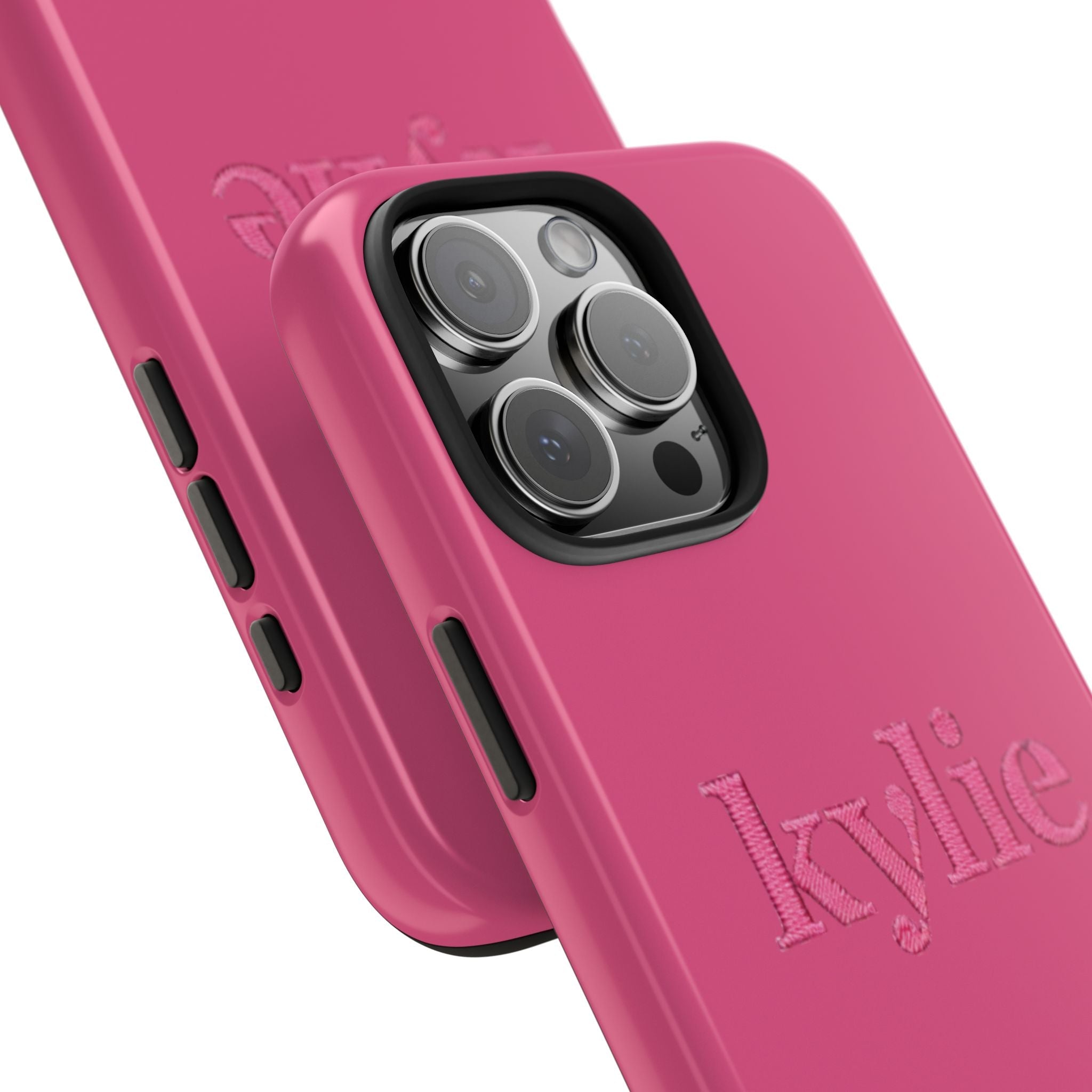 Pink phone case close-up: embroidered name, camera lens cutout, side button openings