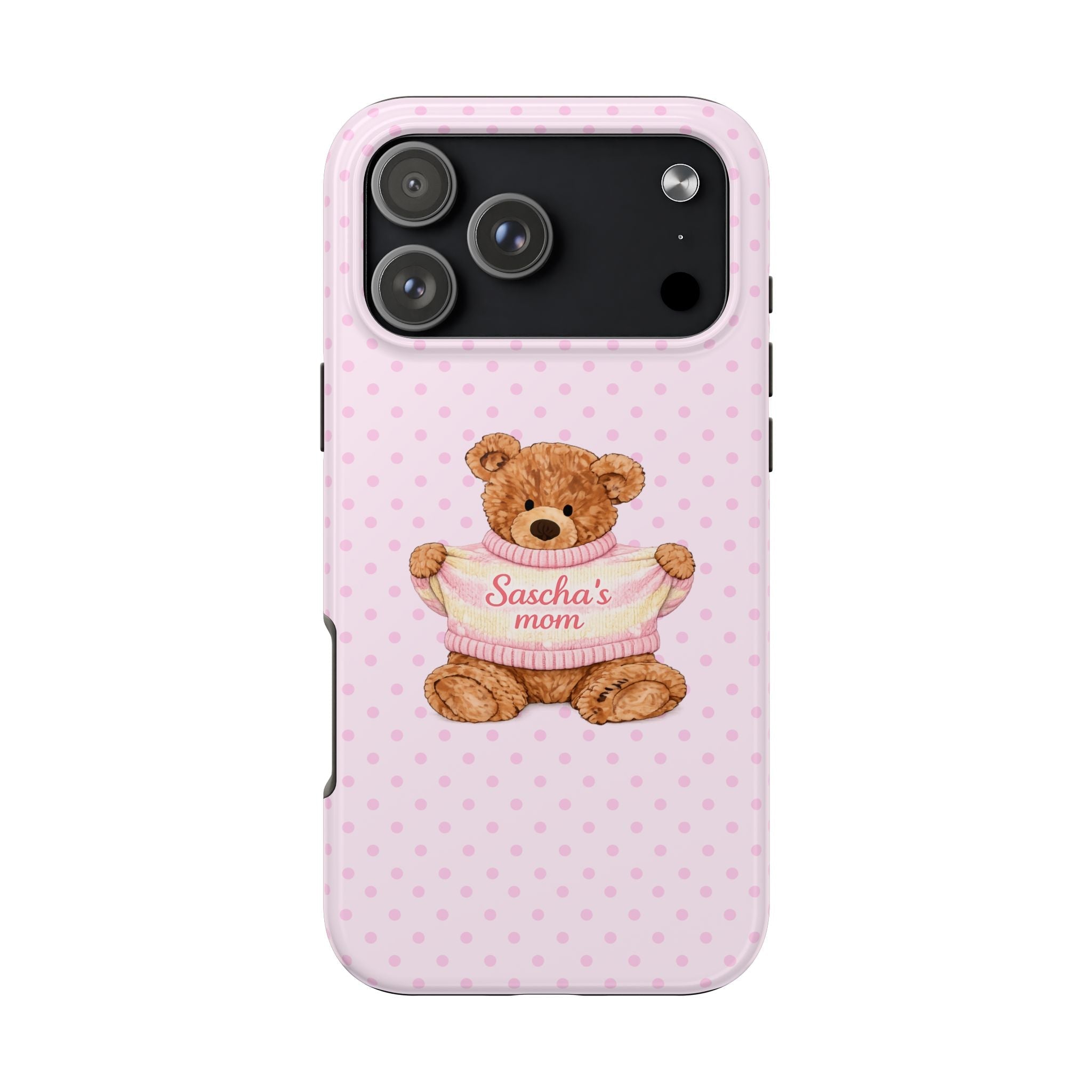 Pink polka-dot phone case with teddy bear face in pink sweater, 'Sascha's mom' text.