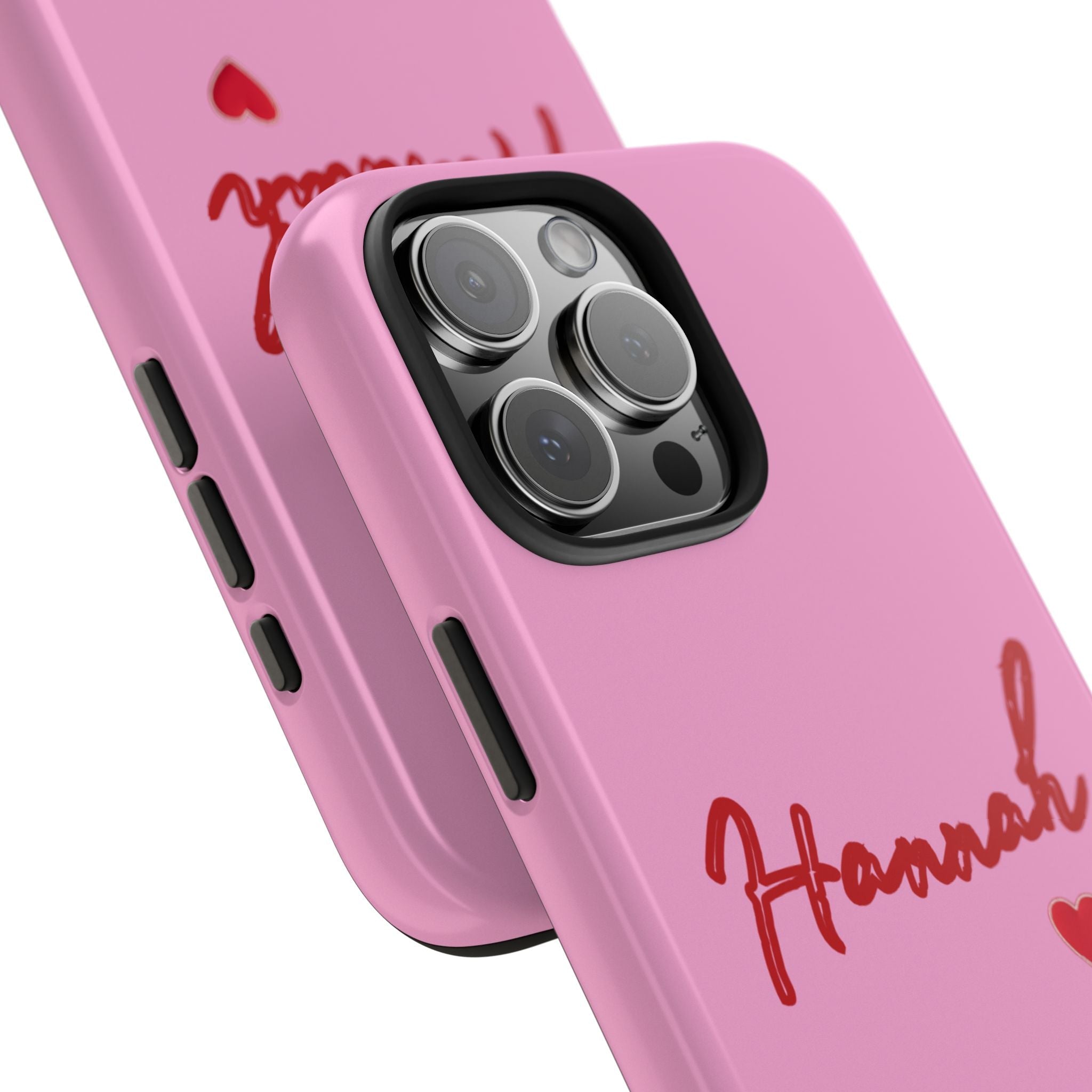 Pink phone case close-up: red name lettering beside camera lenses