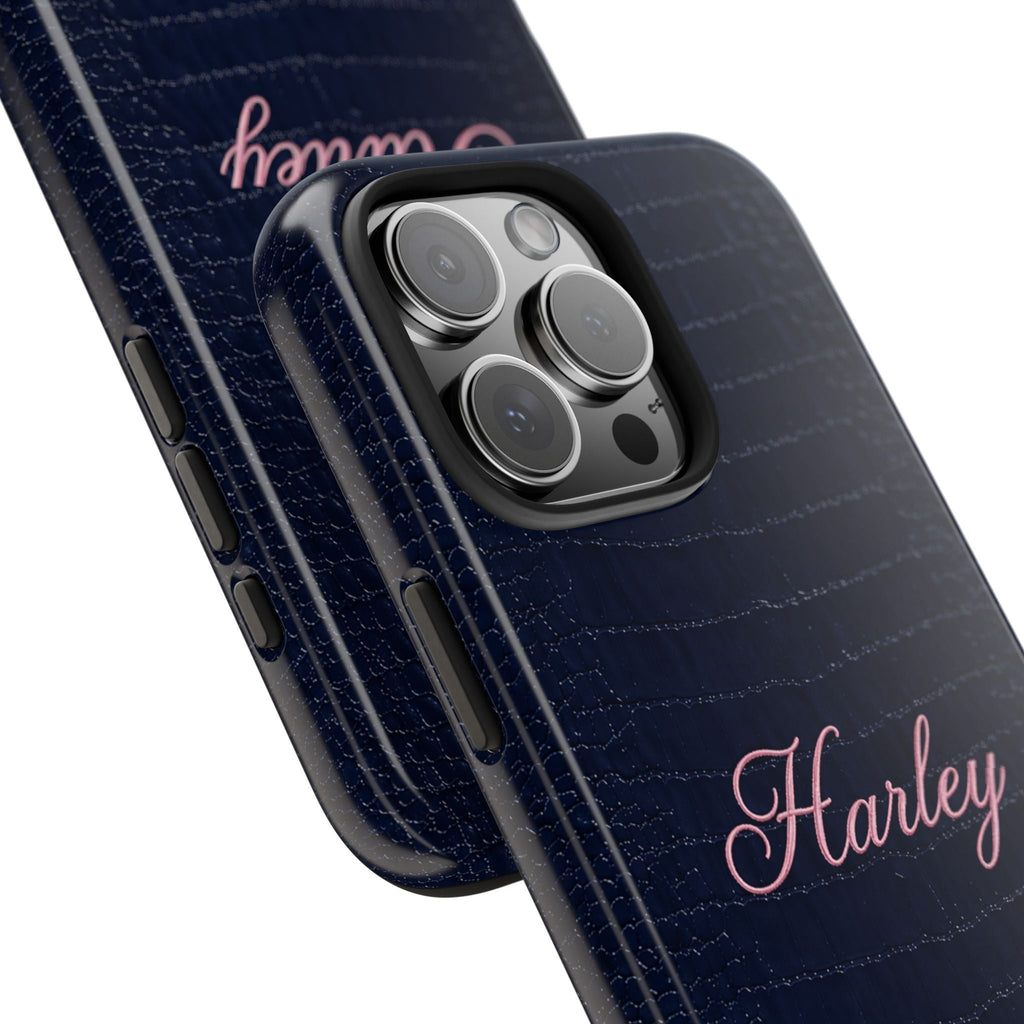 Navy croc-textured phone case, side buttons and Harley script near camera