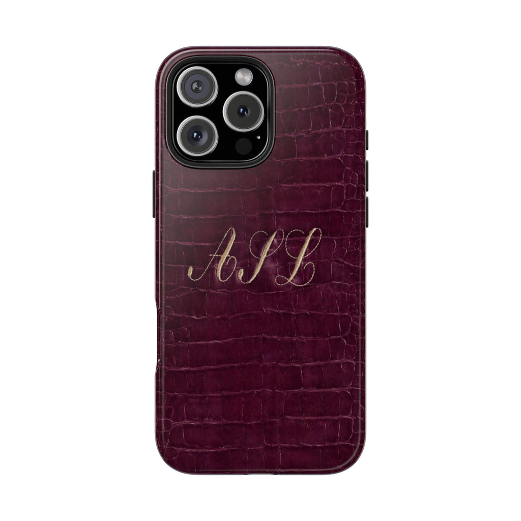 Plum croc-style phone case with gold-style monogram initials across center