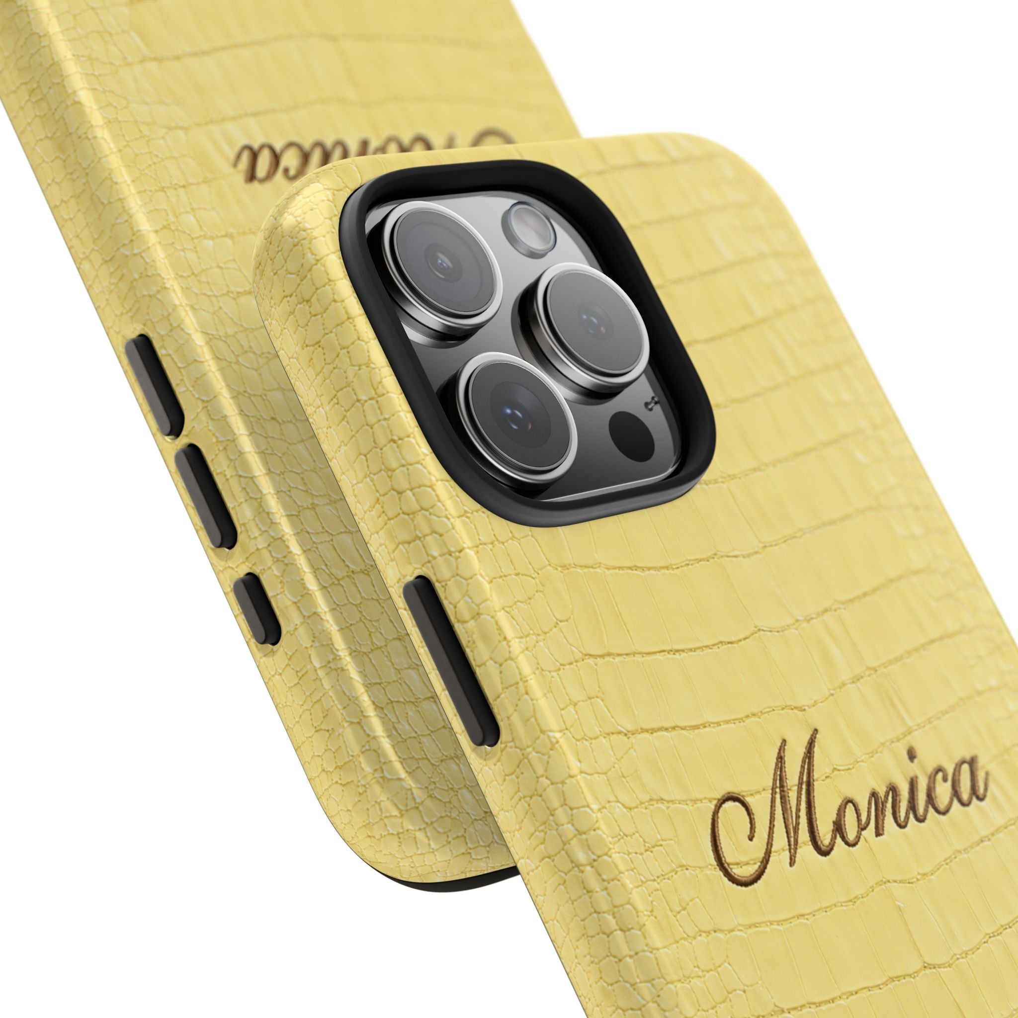 Angled yellow croc-texture phone case with “Monica” script, camera lenses visible