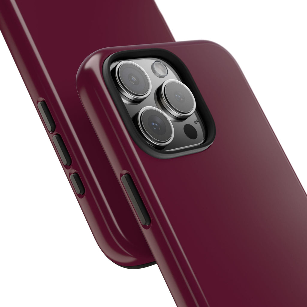 Raspberry pink phone case detail with raised camera lens frame and side buttons