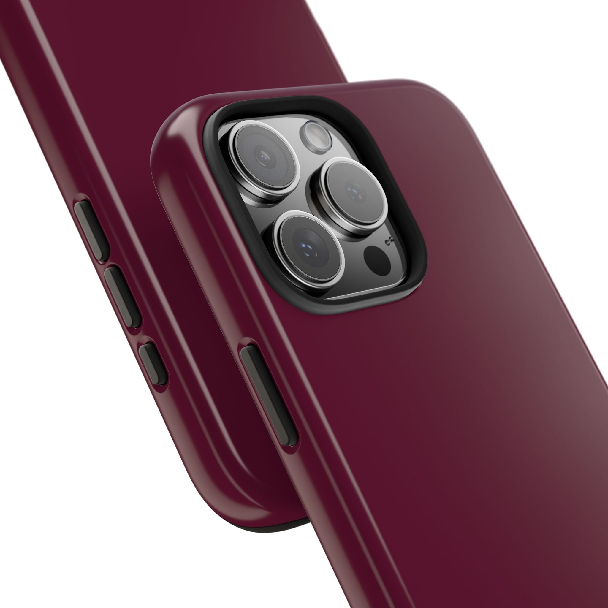 Raspberry pink phone case detail with raised camera lens frame and side buttons