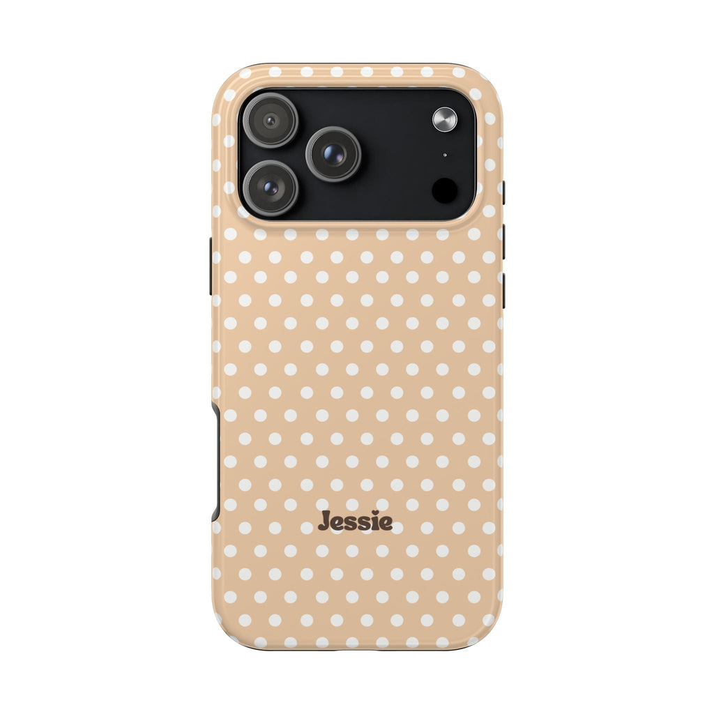 Beige polka dot phone case with name “Jessie” printed near bottom and camera panel