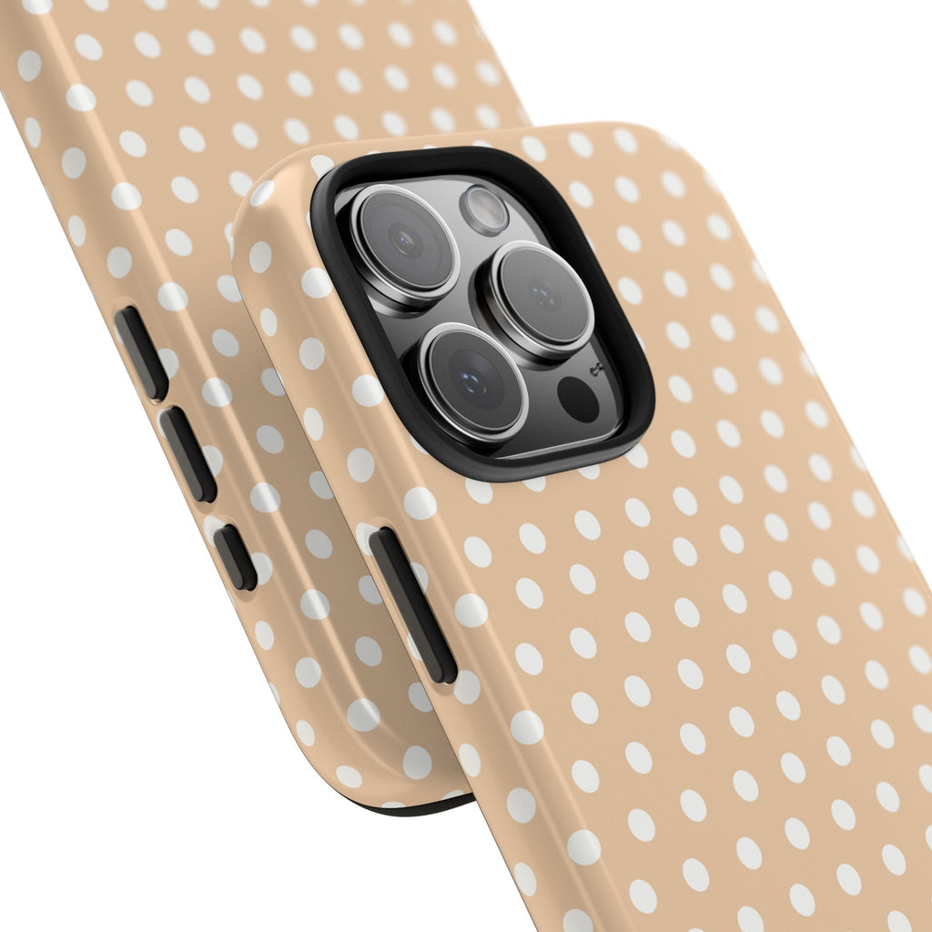 Side view of personalized beige polka dot phone case with name “Jessie” and lens cutout
