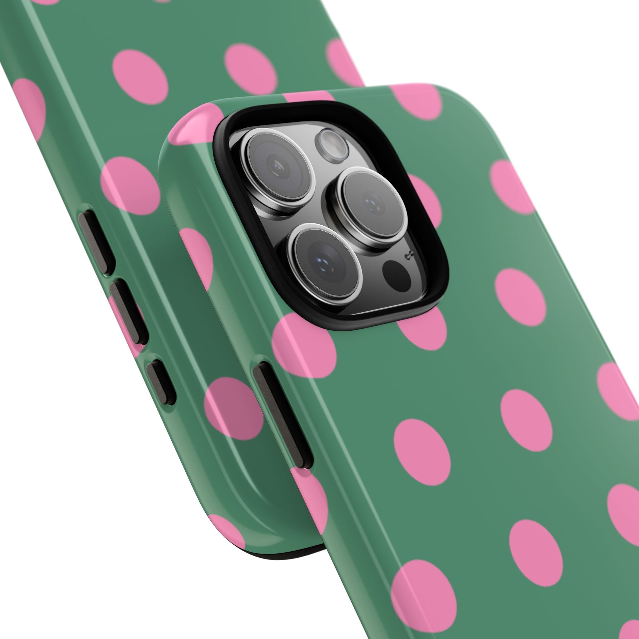 Green polka dot phone case with pink dots; raised camera rim for protection