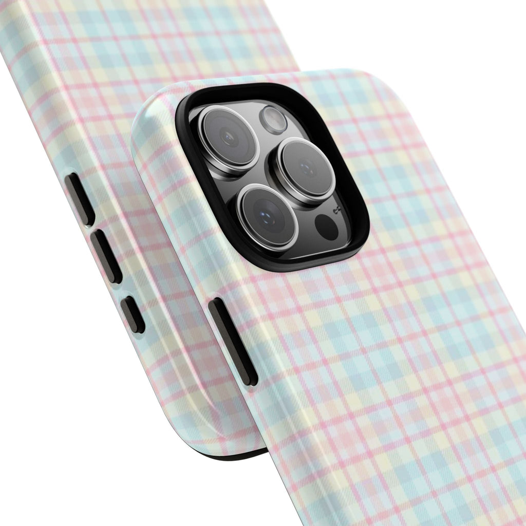 Pastel pink and blue plaid phone case corner view with teddy bear, raised camera lenses