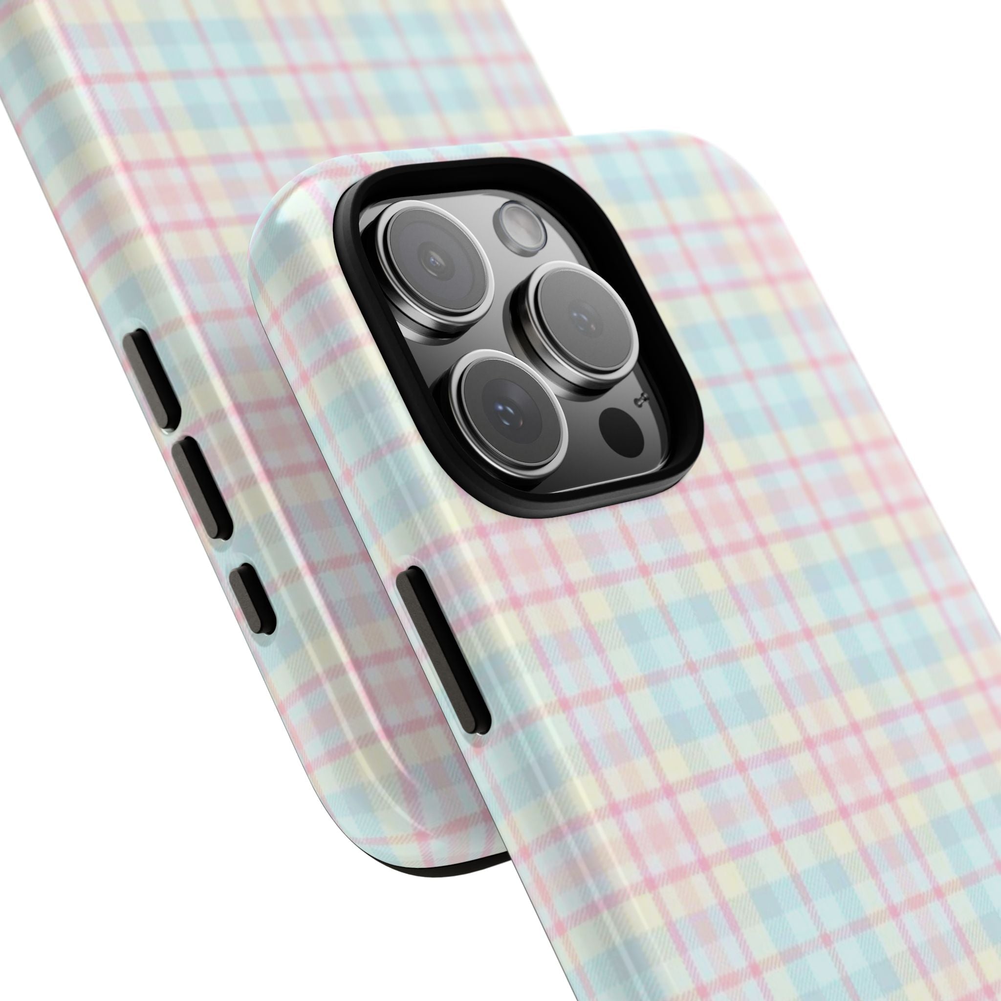 Pastel pink and blue plaid phone case corner view with teddy bear, raised camera lenses