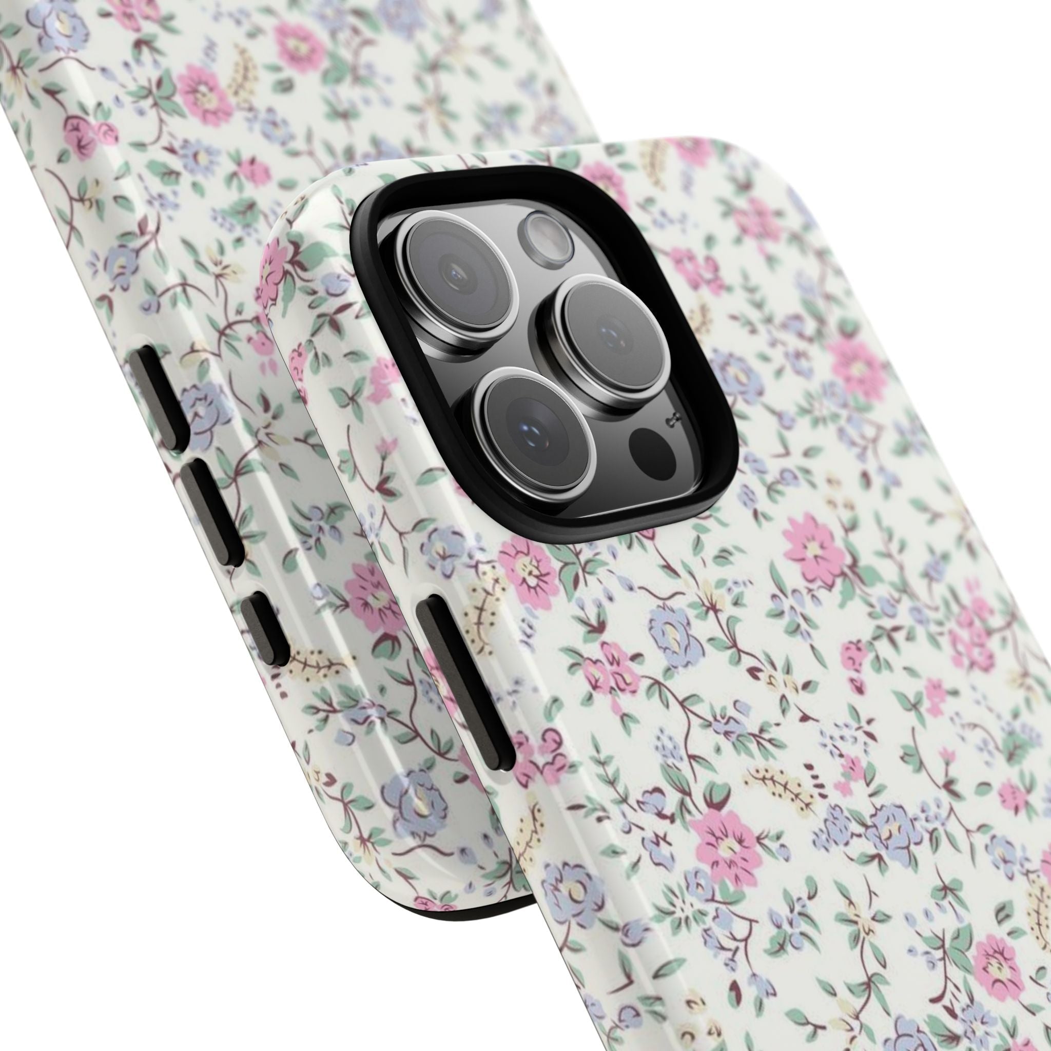 Pink and blue floral phone case angled view showing side button openings and camera lenses