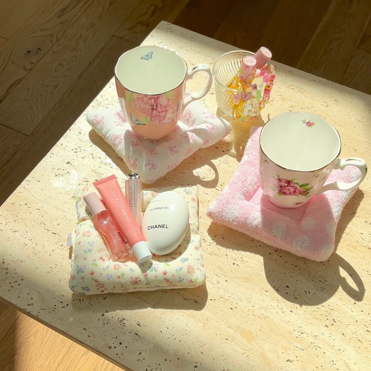 Floral and pink cloud coasters with two pastel mugs on top