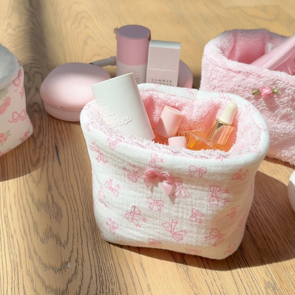 Pink bow coquette fabric organizer with pink ribbon bow and bow-patterned sides