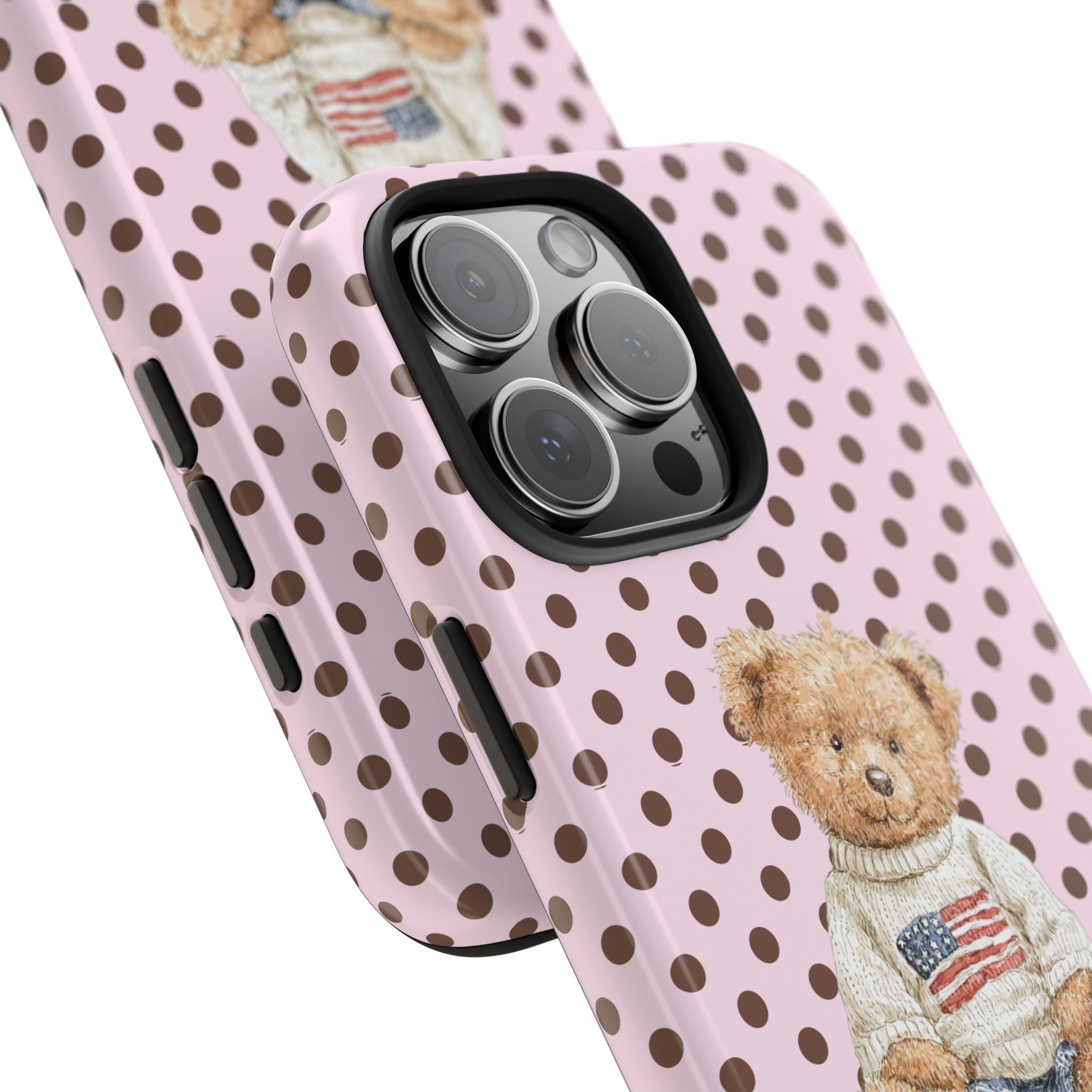 Angled view of pink polka-dot case with teddy bear; side buttons and camera lenses
