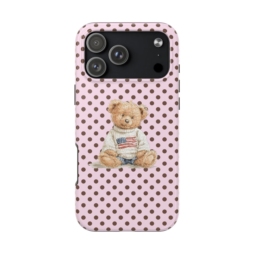 Pink case with brown polka dots and teddy bear graphic; camera cutout, top right