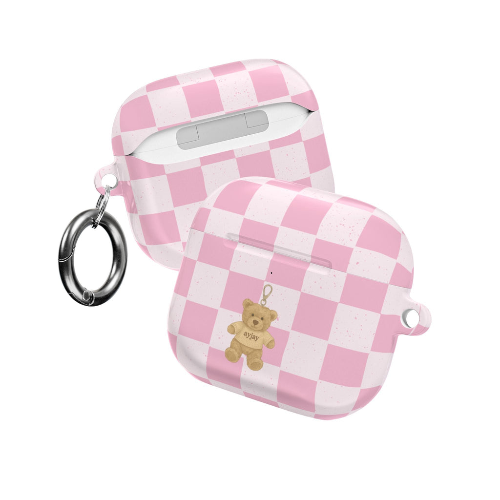 Pink checker AirPods case with teddy bear charm and metal key ring