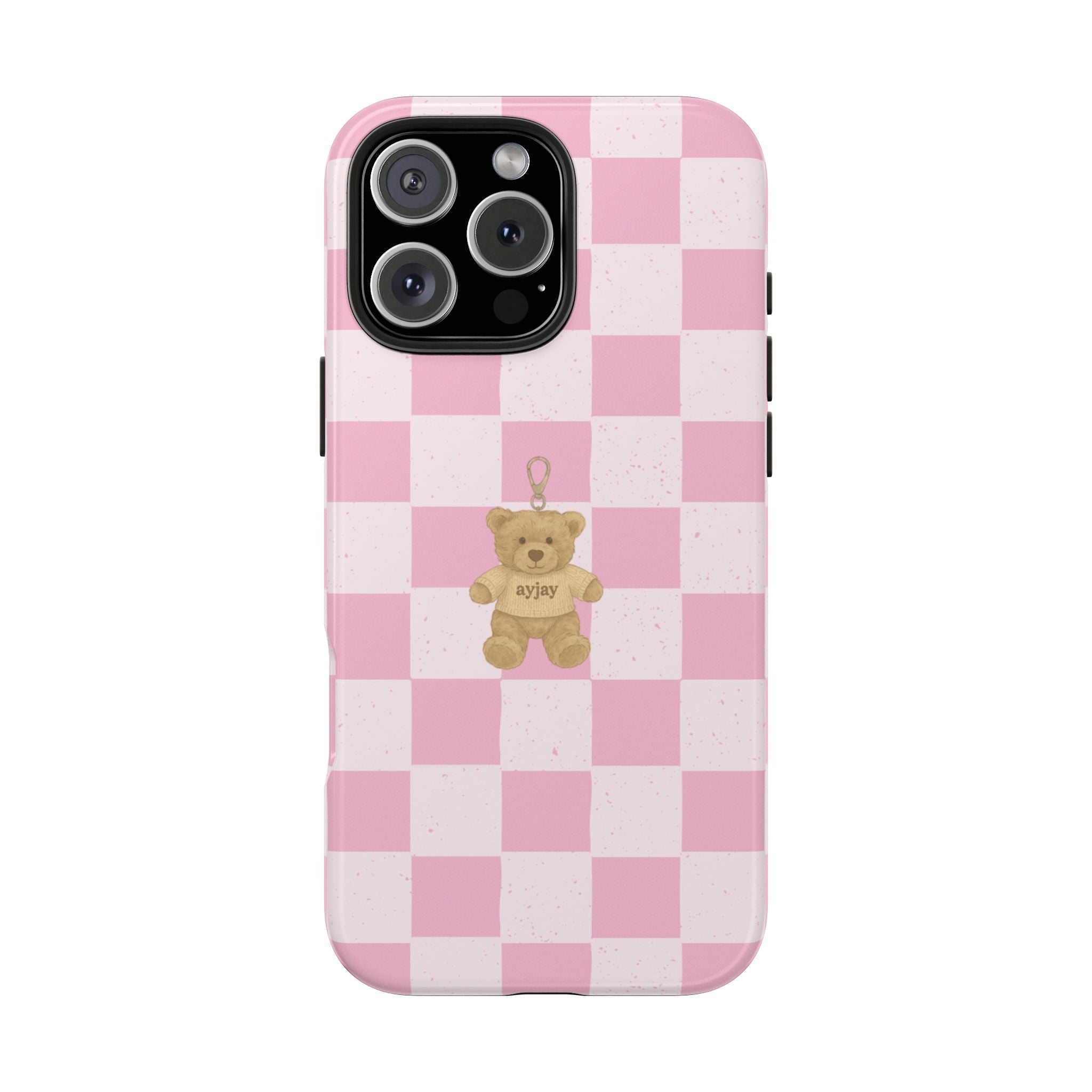 Pink checkered phone case with teddy bear charm on back; cutout for camera lenses