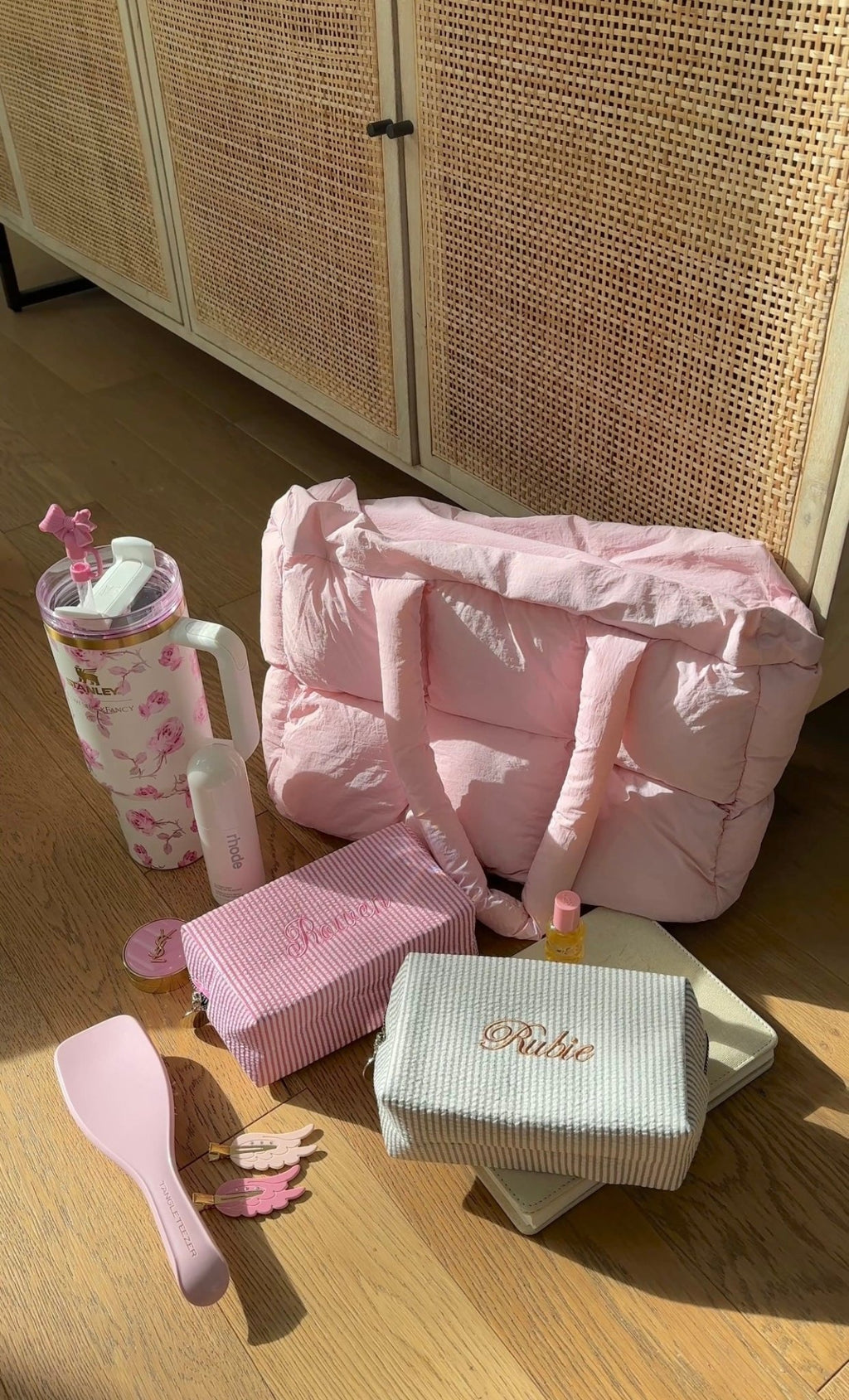 Pink quilted puffer duffle tote bag with sturdy handles and front pocket