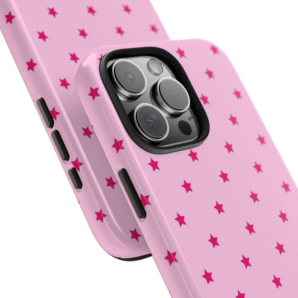 Close-up pink case with red stars and camera lens cutout