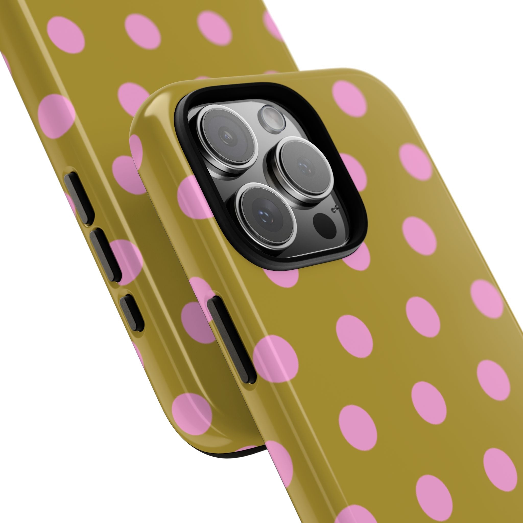 Close-up of yellow phone case with pink polka dots and black camera opening