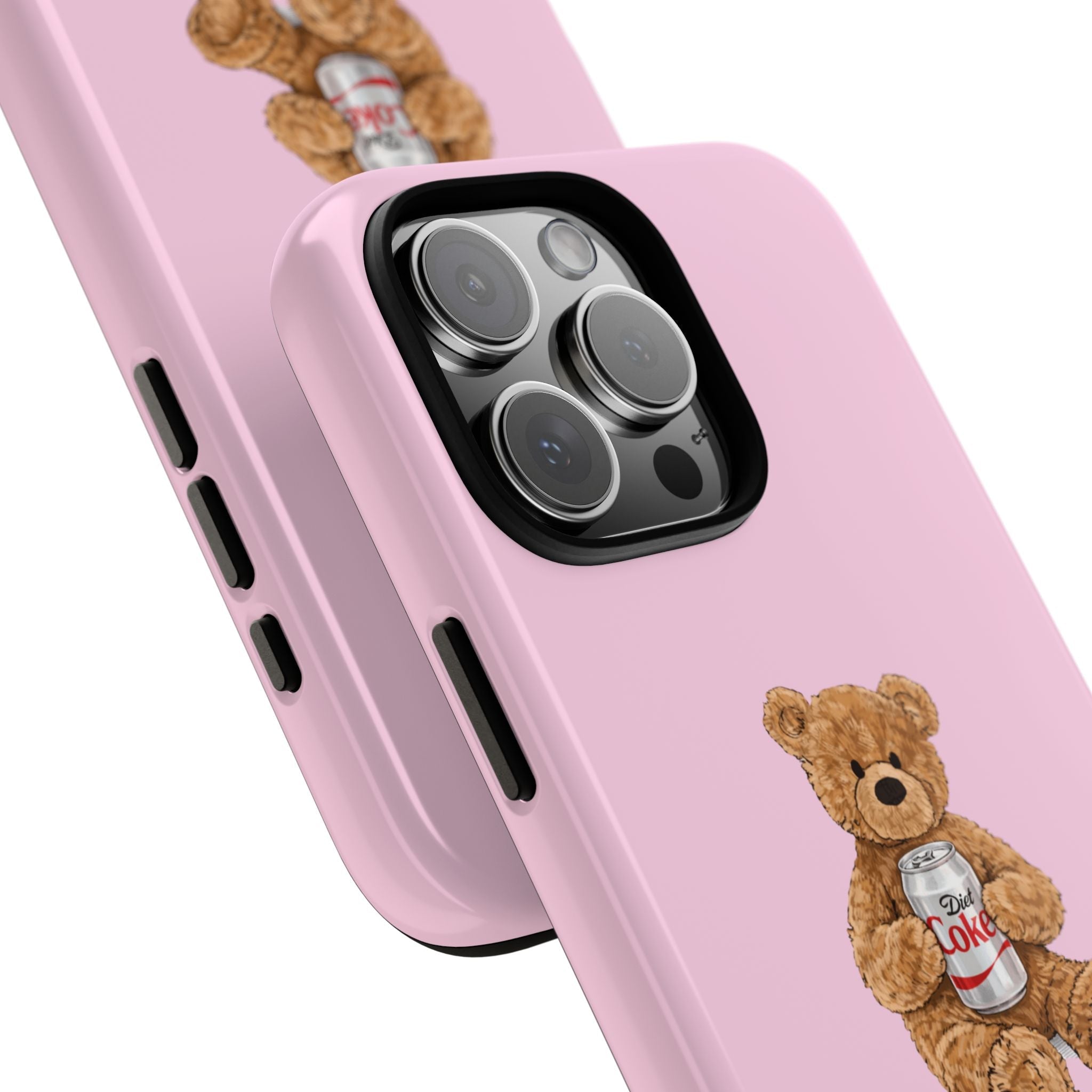 Pink phone case close-up: teddy bear holding Diet Coke can near camera cutout