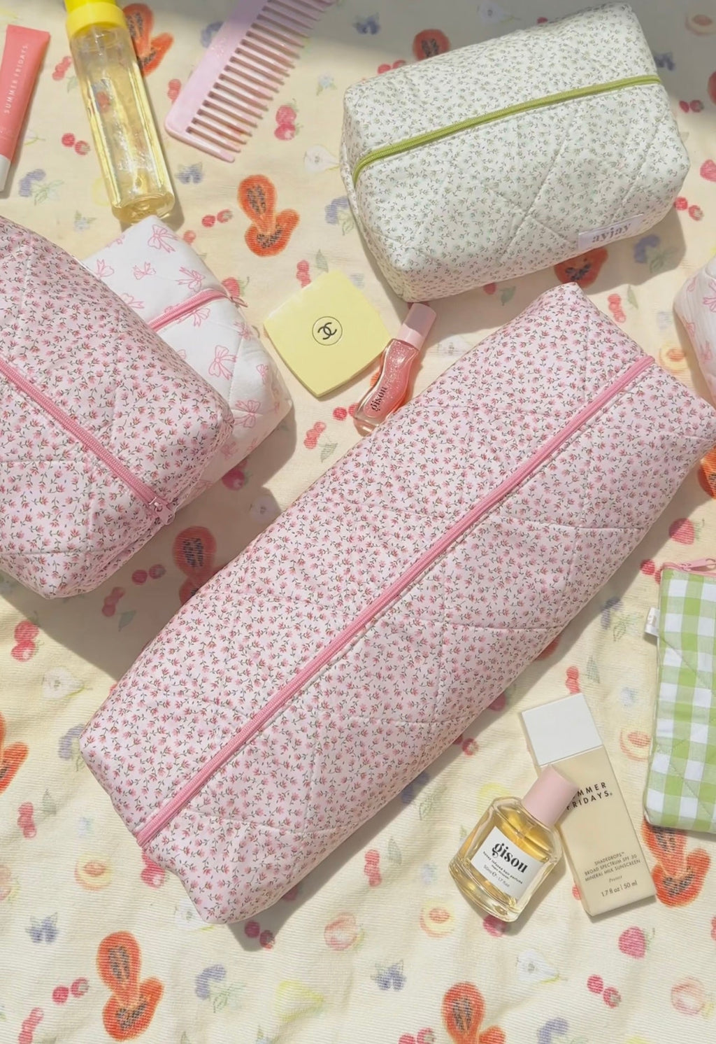 Pink ditsy floral long zip pouch with pink piping and quilted look