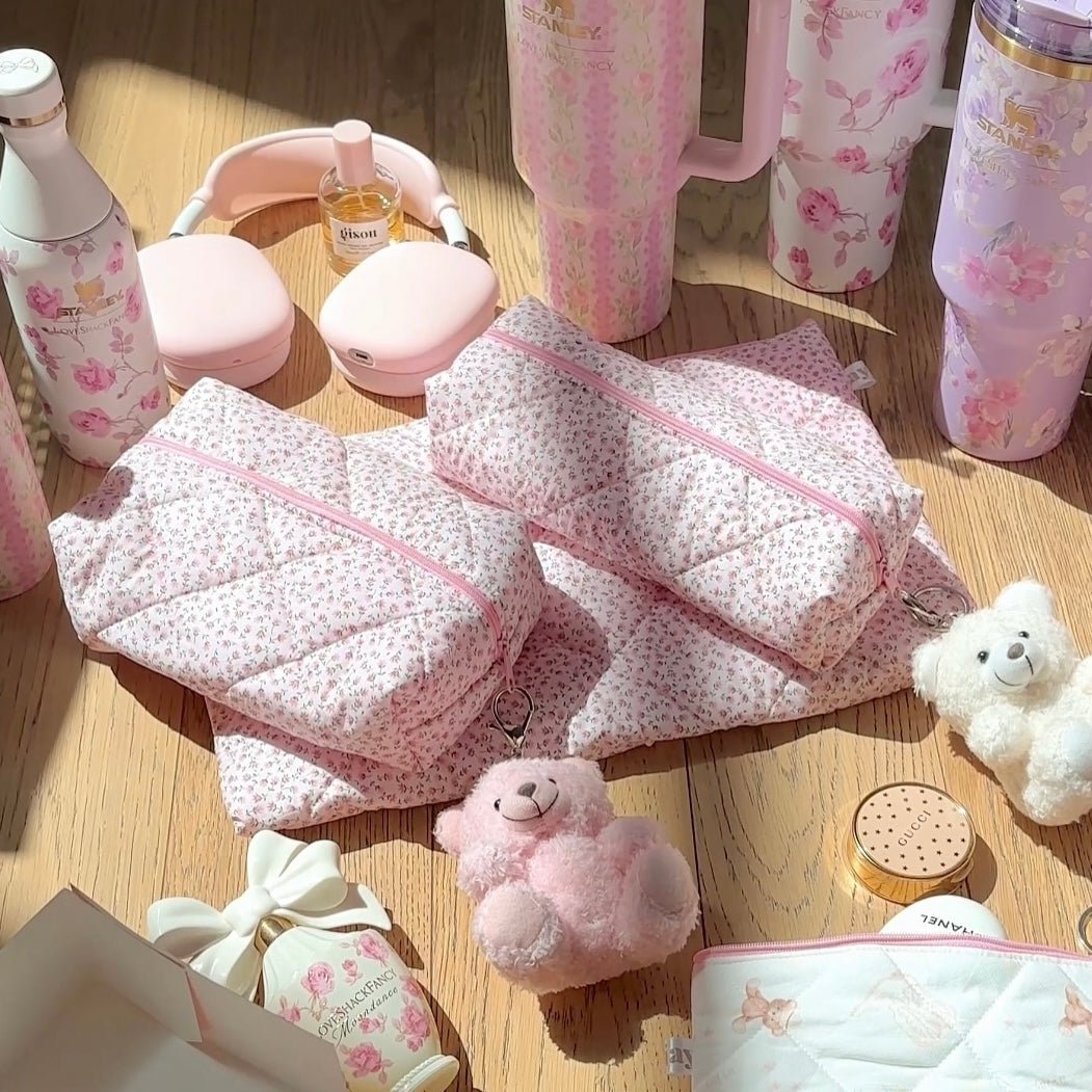 Pink ditsy floral pouch set with pink zippers; soft, padded fabric and handles.