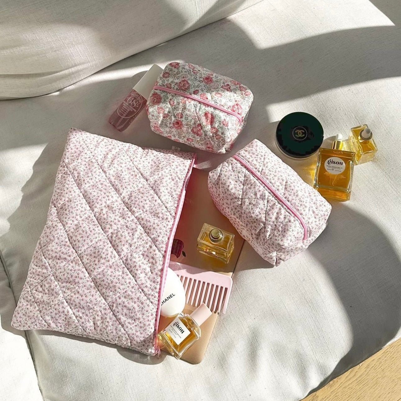 Pink ditsy floral quilted zip pouch with pink trim, plus smaller zip bag